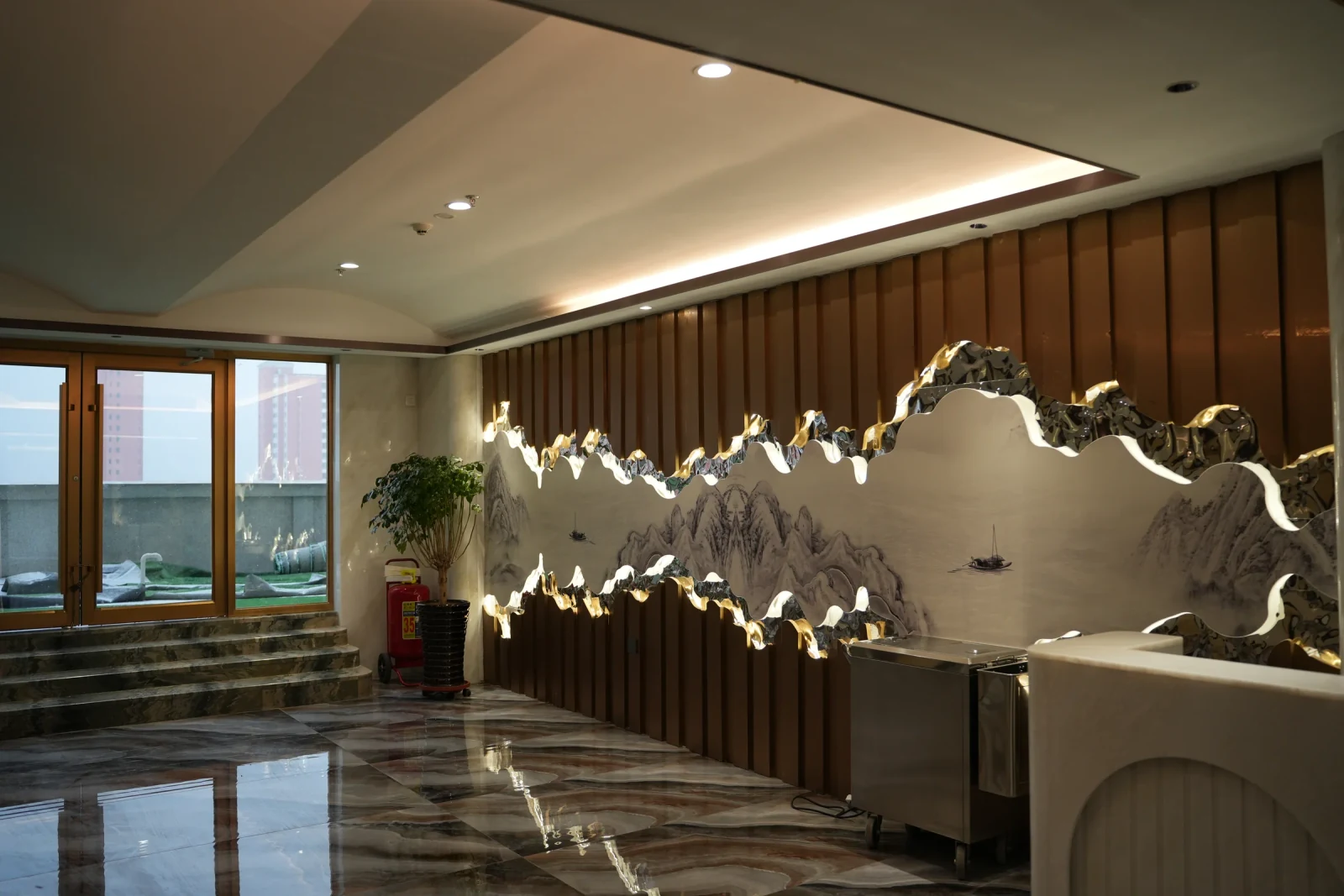 Mountain-shaped metal and lighting composition inside a restaurant