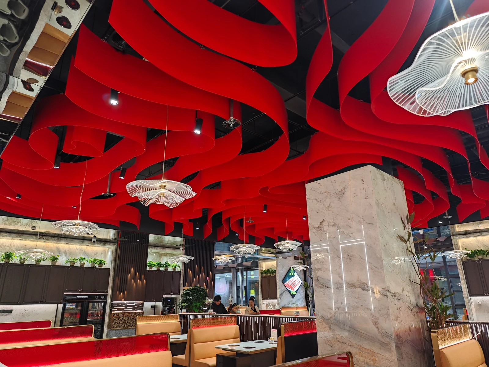 Curved red aluminum ribbon ceiling