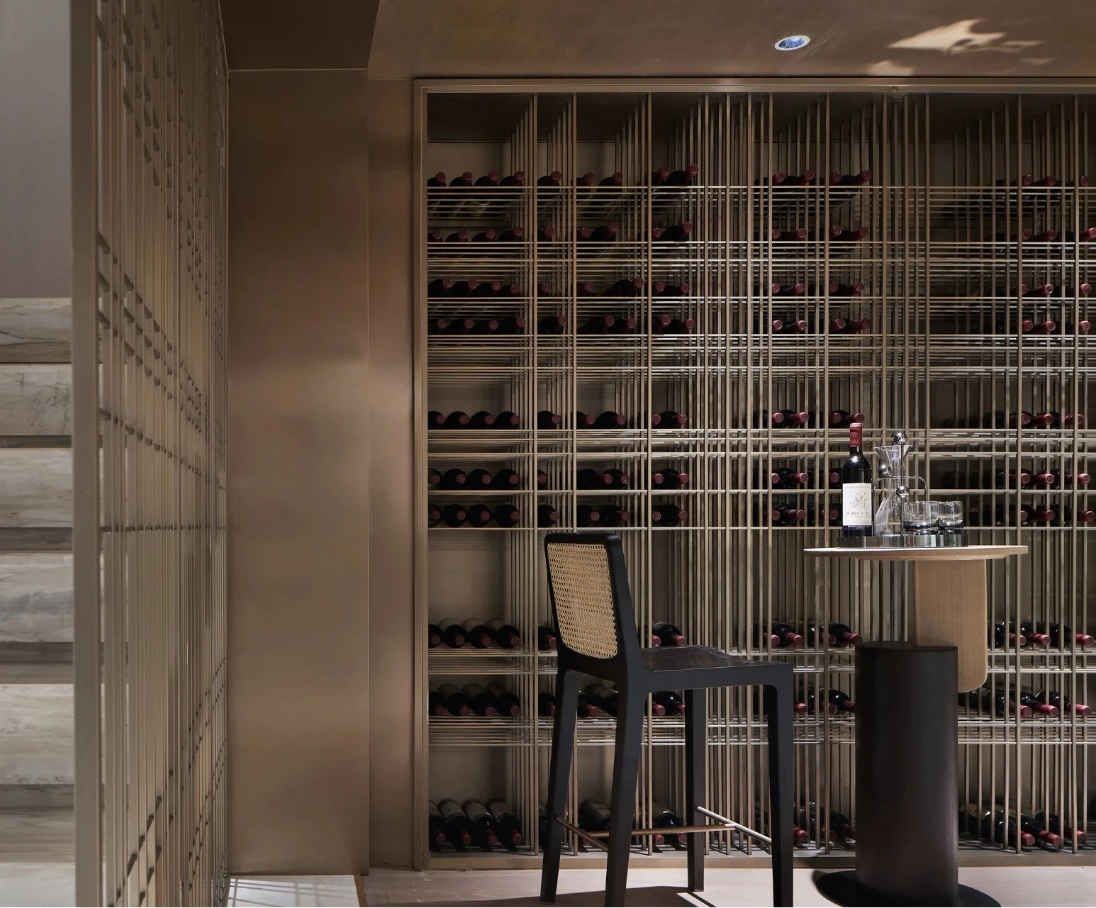 Open wine display — slender metal bottle racks