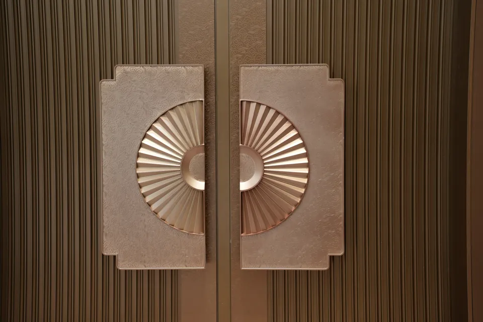 Close view of completed decorative door pulls at the Shantou convention center.