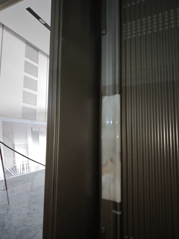 LMC site record of the stainless-steel door-surround package at Shenzhen International Exchange Center.