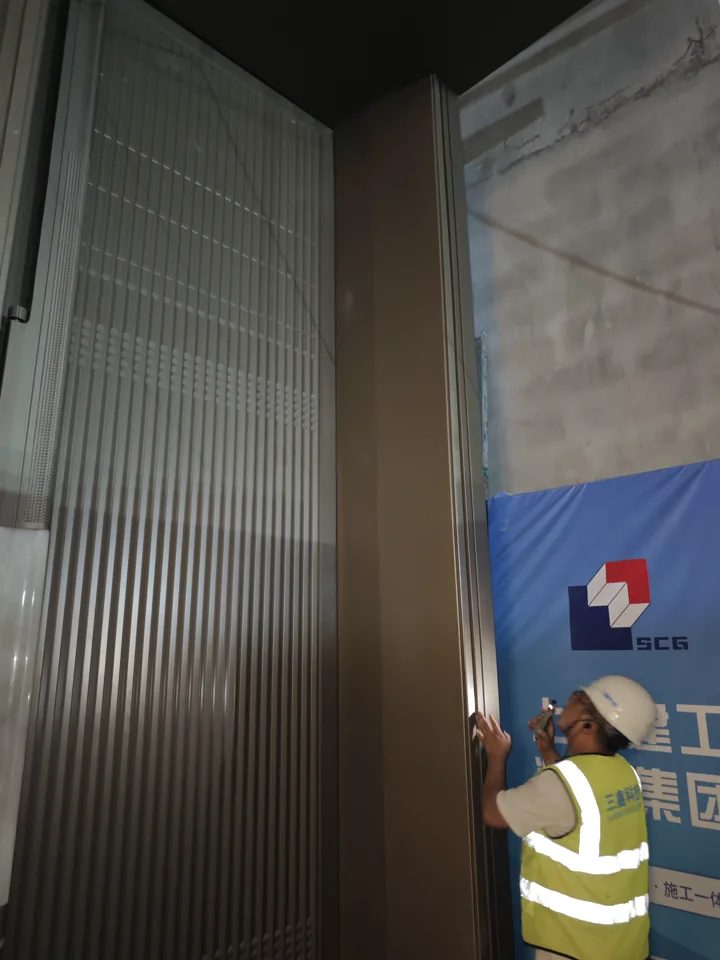 LMC site record showing dimensional checking of a metal door surround at Shenzhen International Exchange Center.