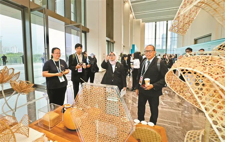 Venue reference image showing the completed Shenzhen International Exchange Center lobby in use.