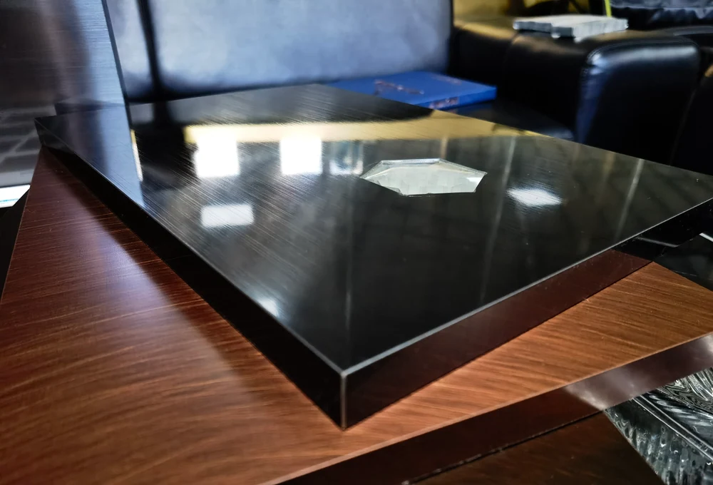 Physical panel samples as a form reference for cabinet fronts and backing panels.