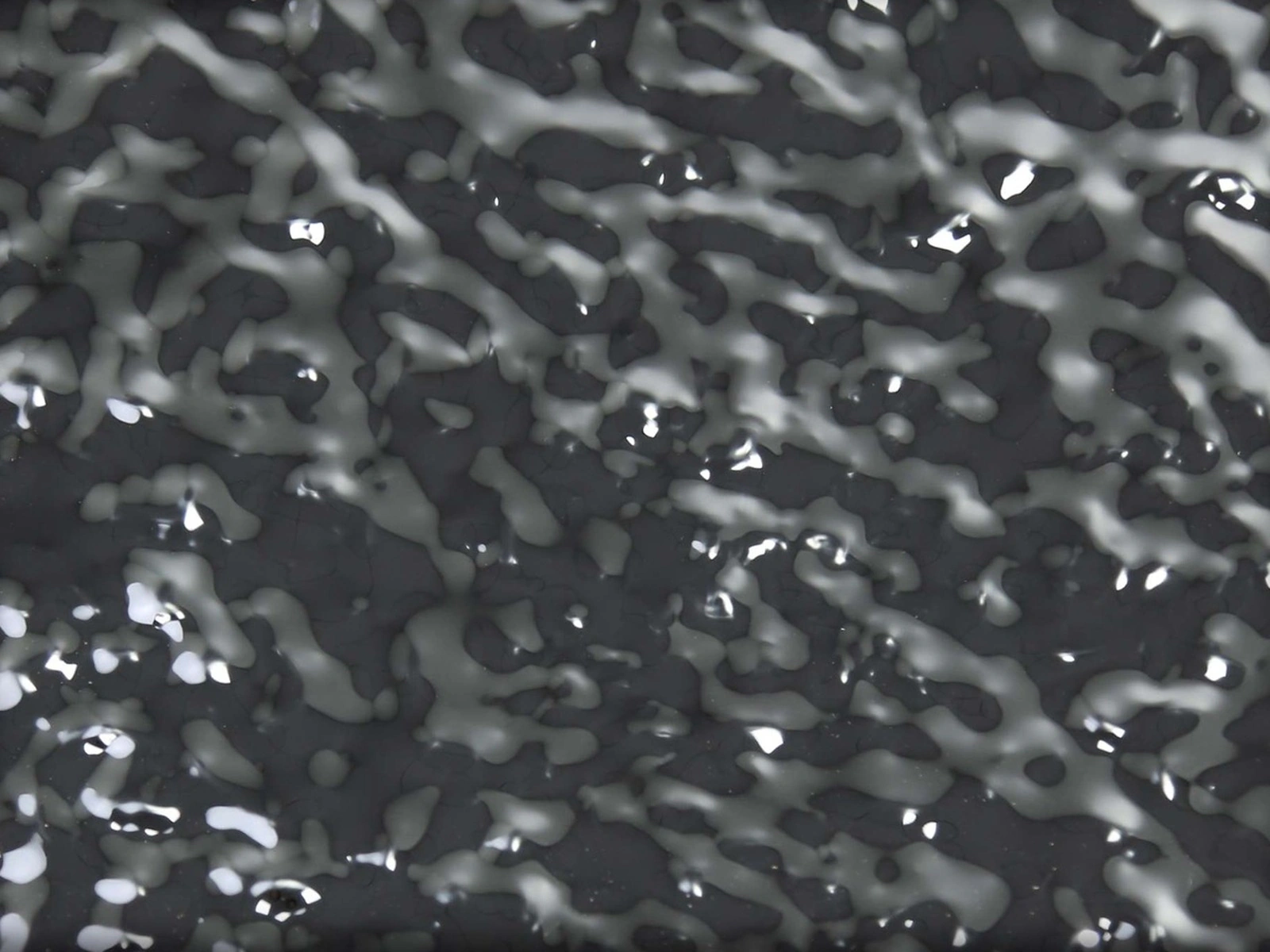 Close view of reflective water-ripple stainless steel texture