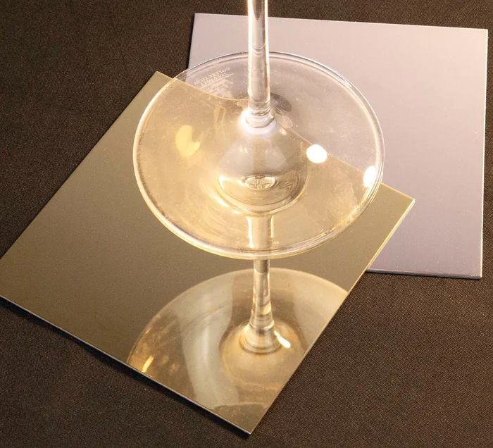 Finish reference showing reflected objects on mirror-polished metal samples
