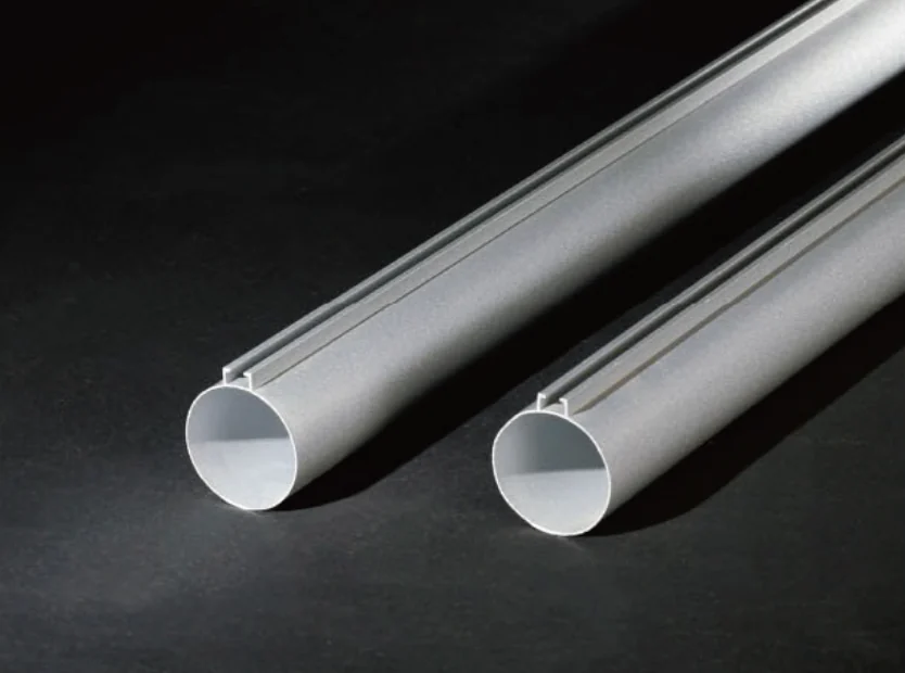 Round aluminum ceiling tubes with top fixing profiles.