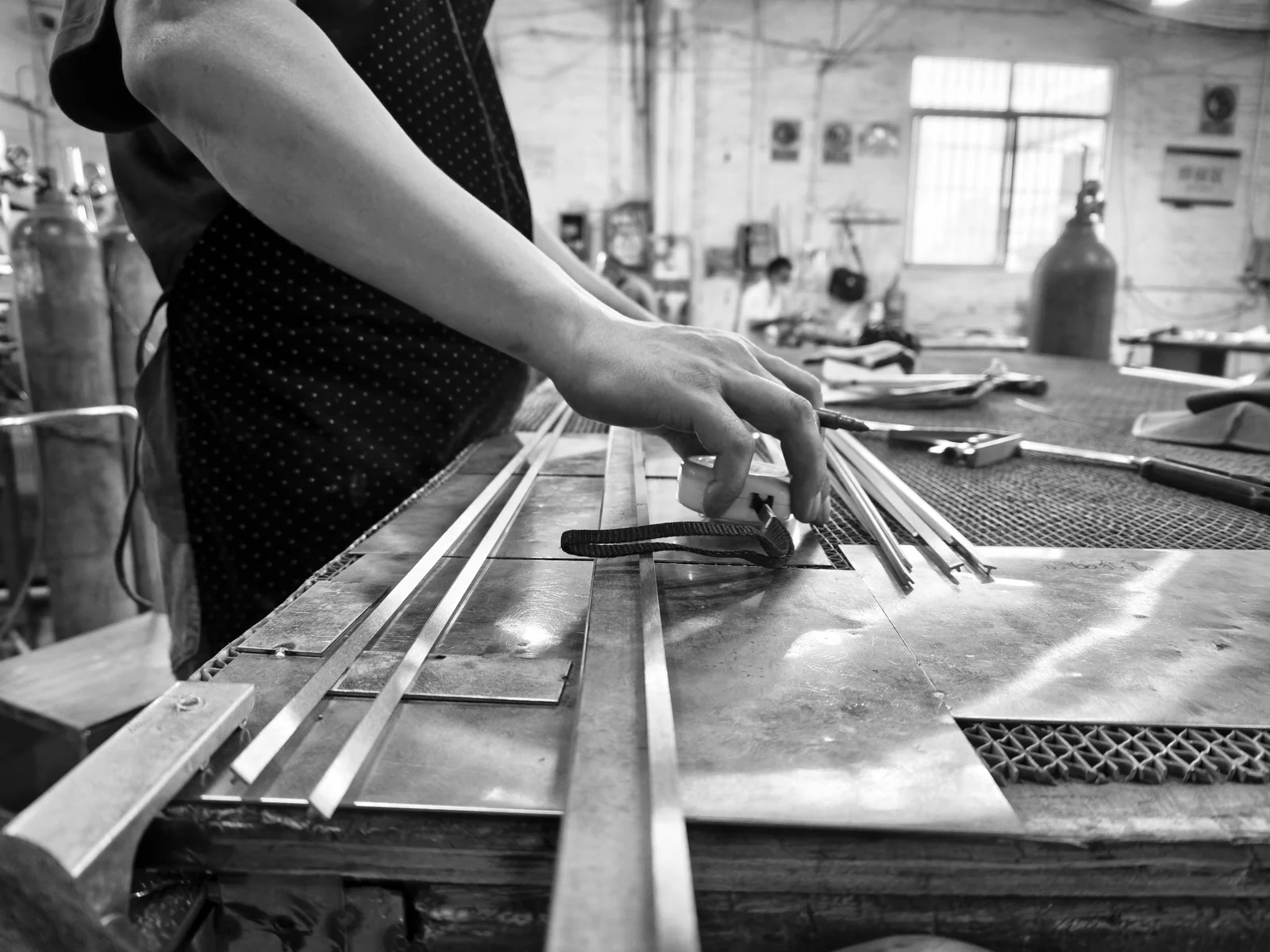 LMC Metal craftsman measuring metal components before fit-up