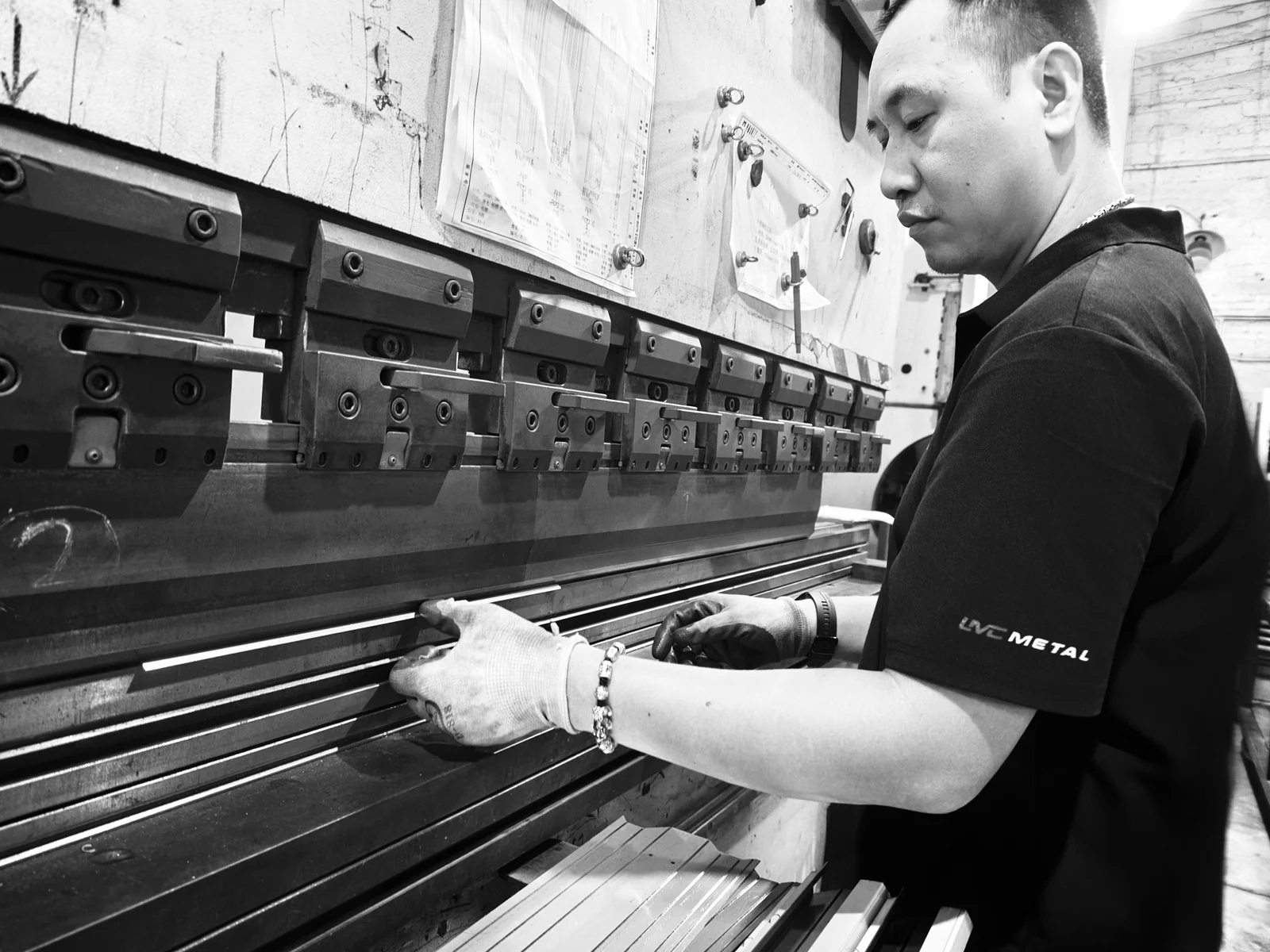 LMC Metal operator positioning a sheet at the press brake