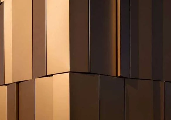 Close view of metal panel finishes, a corner and panel joints